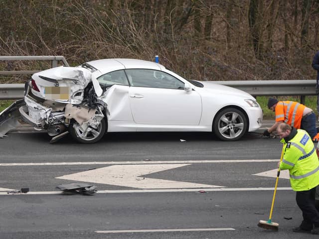A woman was taken to hospital in a ‘serious condition’, while two others sustained ‘minor injuries’, following a five-vehicle collision on the M23. Picture by Eddie Mitchell