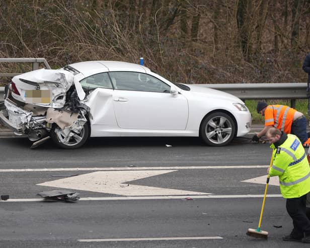 A woman was taken to hospital in a ‘serious condition’, while two others sustained ‘minor injuries’, following a five-vehicle collision on the M23. Picture by Eddie Mitchell