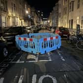 It has been reported that cars are ‘trapped’ after a large sinkhole was cordoned off in Devonshire Place, Brighton. Photo: Eddie Mitchell