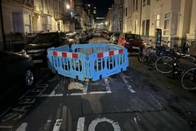 It has been reported that cars are ‘trapped’ after a large sinkhole was cordoned off in Devonshire Place, Brighton. Photo: Eddie Mitchell