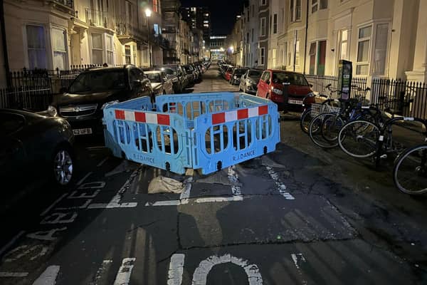 It has been reported that cars are ‘trapped’ after a large sinkhole was cordoned off in Devonshire Place, Brighton. Photo: Eddie Mitchell