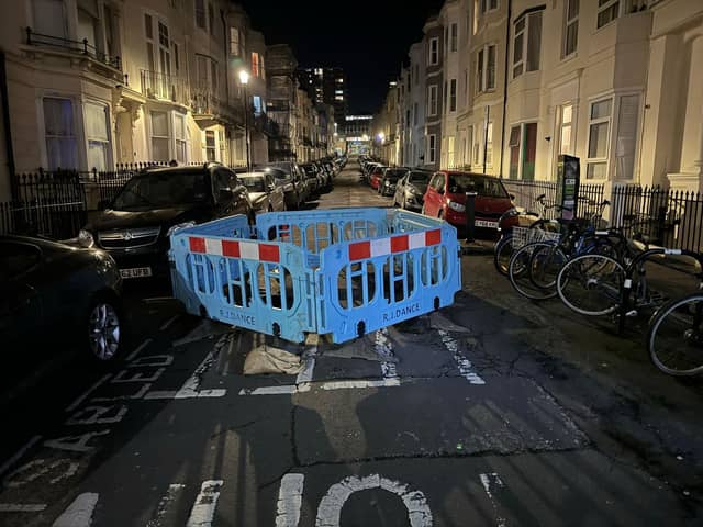 It has been reported that cars are ‘trapped’ after a large sinkhole was cordoned off in Devonshire Place, Brighton. Photo: Eddie Mitchell