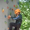 Cub Scout enjoying climbing