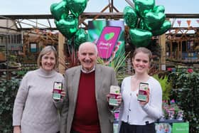 From 29 to 88 years old: Three generations of the Squire family proudly display the new ‘Friends of Squire’s’ app on their phones. Colin Squire – Chairman Emeritus (centre) with his daughter, Sarah Squire – Chairman (left) and                             granddaughter, Felicia Baily – Squire’s Sustainability Lead (right).