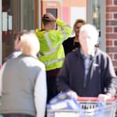 People are queueing for cash points outside Sainsbury’s stores in Sussex after a major IT fault, which has prevented card payments.