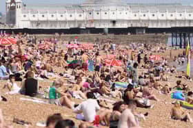 People enjoying the glorious Sussex sunshine on Brighton's beach. Photo: Sussex News and Pictures