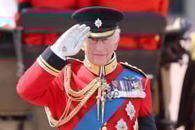 LONDON, ENGLAND - JUNE 14: King Charles II salutes during Trooping The Colour 2025 on June 14, 2025 in London, England. Trooping The Colour is a ceremonial parade celebrating the official birthday of the British Monarch. The event features over 1,400 soldiers and officers, accompanied by 200 horses. More than 400 musicians from ten different bands and Corps of Drums march and while performing. (Photo by Chris Jackson/Getty Images)
