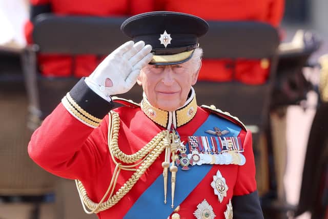 LONDON, ENGLAND - JUNE 14: King Charles II salutes during Trooping The Colour 2025 on June 14, 2025 in London, England. Trooping The Colour is a ceremonial parade celebrating the official birthday of the British Monarch. The event features over 1,400 soldiers and officers, accompanied by 200 horses. More than 400 musicians from ten different bands and Corps of Drums march and while performing. (Photo by Chris Jackson/Getty Images)