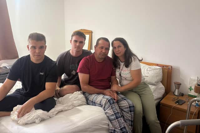 The Alukii family in their parents' bedroom. From left to right: Maxsym, Oleksandr, Dmytro and Iryna. (Credit: Emily Dalton/ LDRS)