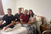The Alukii family in their parents' bedroom. From left to right: Maxsym, Oleksandr, Dmytro and Iryna. (Credit: Emily Dalton/ LDRS)