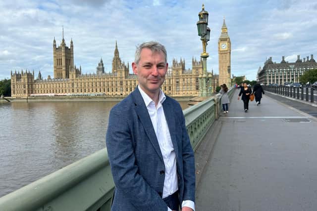 Woking MP Will Forster outside the Houses of Parliament (image Will Forster)