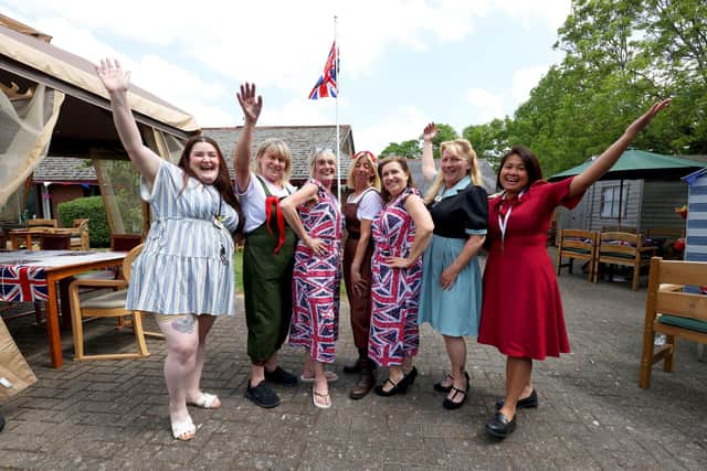 Team members in their themed outfits celebrating VE Day