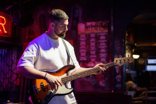 Musician playing at local Greene King pub