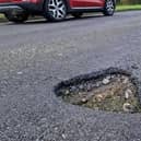 New research by claims.co.uk has named the local authorities in England which received the most additional budget per mile for repairing potholes. Photo: Sussex World
