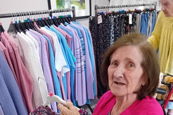 Jean looking at a beautiful new top