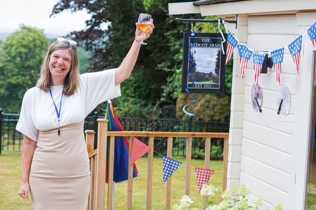 Jan Daly, the Registered Manager at The Redcot Arms with a Fruit Punch - ready to welcome visitors