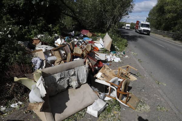 Fly-tipped rubbish and waste is seen beside a road in Colnbrook, near Heathrow, west of London on May 11 2020.