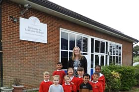 Headteacher Karen Ney with pupils.