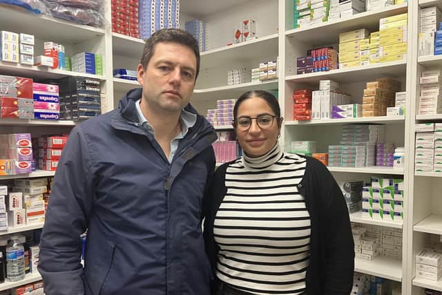 MP Chris Coghlan (left) visiting Asma'a (right) at her family-run pharmacy in Horley. (Credit: Emily Dalton/LDRS)