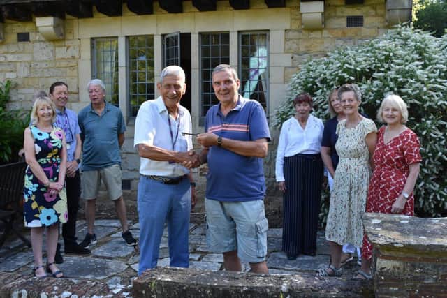 LCFT Co-Chairman, Jeff Harris (right centre) hands over the keys to YMCA Chairman Paul Byrne (left