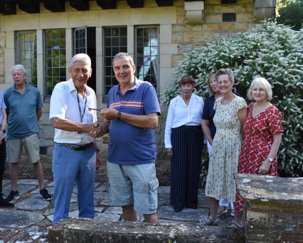 LCFT Co-Chairman, Jeff Harris (right centre) hands over the keys to  YMCA Chairman Paul Byrne (left