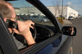 PICTURE POSED BY MODEL. File photo dated 14/02/2007 of a driver talking on his mobile telephone while driving. Sightings of handheld mobile phone use by drivers are common on UK roads despite Friday being the 20th anniversary of the practice being banned, a survey suggests. Some 93% of respondents to a poll of more than 12,000 AA members said they often see other motorists using a phone at the wheel. Issue date: Friday December 1, 2023.