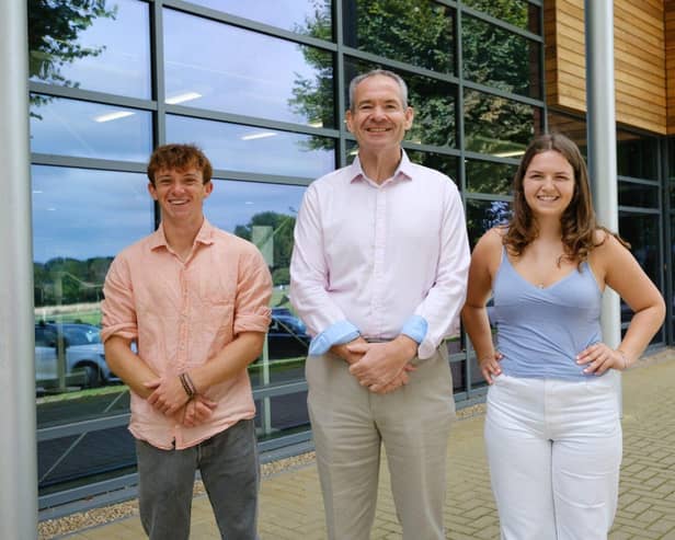 Headmaster John Green with Head Boy Ollie Bagley and Lily Murdoch celebrating A Level success
