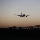 A plane arrives at Heathrow Airport. (Photo by Hollie Adams/Getty Images)