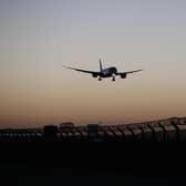 A plane arrives at Heathrow Airport. (Photo by Hollie Adams/Getty Images)