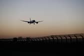 A plane arrives at Heathrow Airport. (Photo by Hollie Adams/Getty Images)