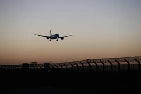 A plane arrives at Heathrow Airport. (Photo by Hollie Adams/Getty Images)
