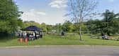 Students enjoying University of Surrey land including lake. (Credit: Google Street View)