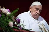 Pope Francis stands at the main balcony of St. Peter's basilica for the Urbi et Orbi message and blessing to the city and the world as part of Easter celebrations, at St Peter's square in the Vatican on April 20, 2025. (Photo by Tiziana FABI / AFP) (Photo by TIZIANA FABI/AFP via Getty Images)