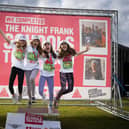 A team celebrating their completion of the 2024 Charterhouse Schools Triathlon