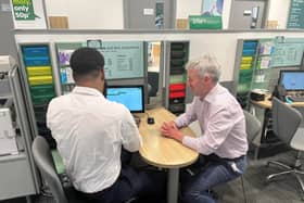 Will Forster MP visiting Specsavers Woking