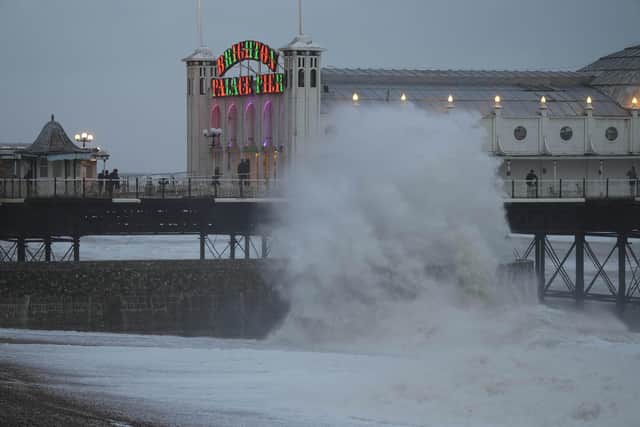 Multiple trees and power cables have blocked roads across the country, flood warnings are in place and people have been told to not travel by train 'unless absolutely necessary'. Photo taken in Brighton by Eddie Mitchell