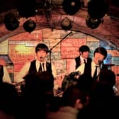 The Mersey Beatles performing inside The Cavern Club, Liverpool.
