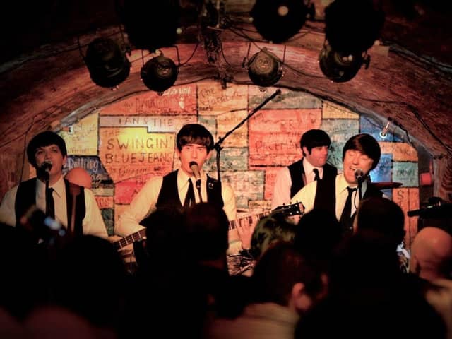 The Mersey Beatles performing inside The Cavern Club, Liverpool.