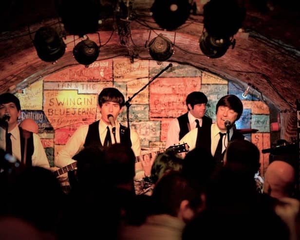The Mersey Beatles performing inside The Cavern Club, Liverpool.