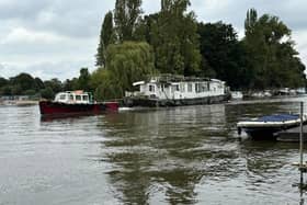 Boat being towed away by joint enforcement in Molesey, Elmbridge. (Credit: Cllr Kevin Whincup)