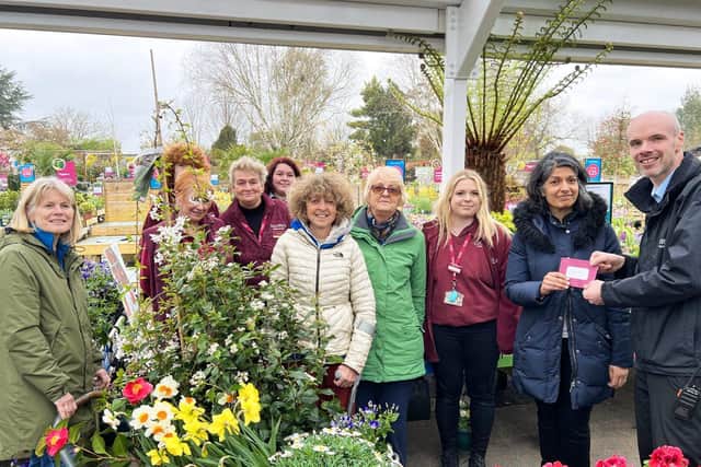 Squire’s Milford present Farncombe Community Garden with their LWYL Award,