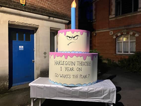 Harlequin Support Group's prop birthday cake, asking what the plan is for the theatre one year on. ((Credit: Emily Dalton/LDRS)