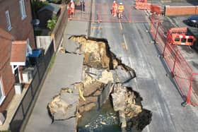 Buildings have been evacuated in Godstone after a large sinkhole emerged in the middle of the high street.