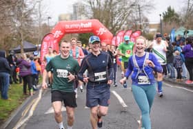 Runners taking off from RunThrough Surrey Half start line