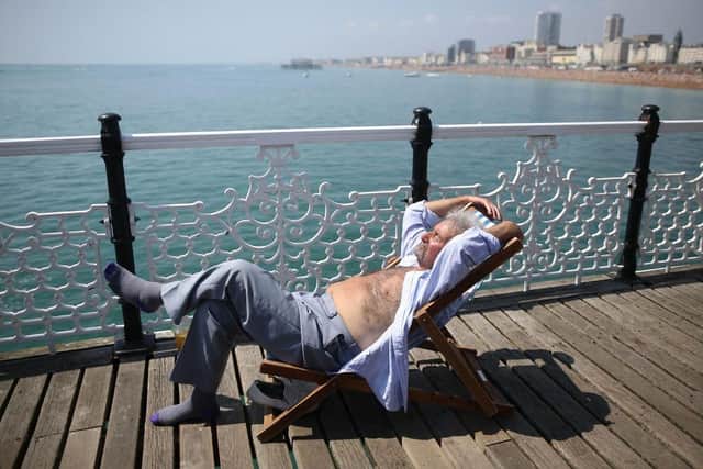 As a mini-heatwave hits Sussex and Surrey, sleep experts have share six tips to get a good night's rest. (Photo by Jordan Mansfield/Getty Images)