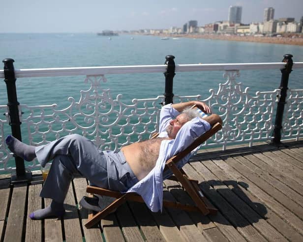 As a mini-heatwave hits Sussex and Surrey, sleep experts have share six tips to get a good night's rest. (Photo by Jordan Mansfield/Getty Images)