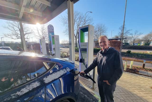 Daniel Topp charges his car at the new facility after returning from a family holiday in Mexico. Picture: Mark Dunford/SussexWorld.co.uk