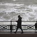 The Met Office has warned there is a 'small chance' that injuries and danger to life 'could occur' from large waves and beach material being thrown onto sea fronts, coastal roads and properties. (Photo taken in Brighton by Peter Nicholls/Getty Images)