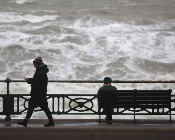 The Met Office has warned there is a 'small chance' that injuries and danger to life 'could occur' from large waves and beach material being thrown onto sea fronts, coastal roads and properties. (Photo taken in Brighton by Peter Nicholls/Getty Images)