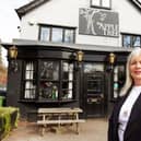 Publican Sue McGovern outside the pub as it looks now